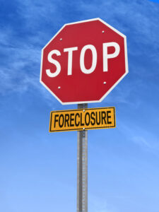 Notice of foreclosure document with model house and gavel
