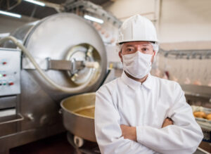 Worker at meat packing plant